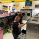 People using the washing machines during the free laundry event