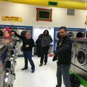 Directing traffic on free laundry night at Laundromania in Davenport Iowa