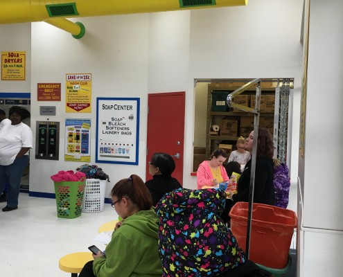 Waiting for laundry on Wednesday April 6 2016 Free Laundry event at Laundromania in Davenport, Iowa