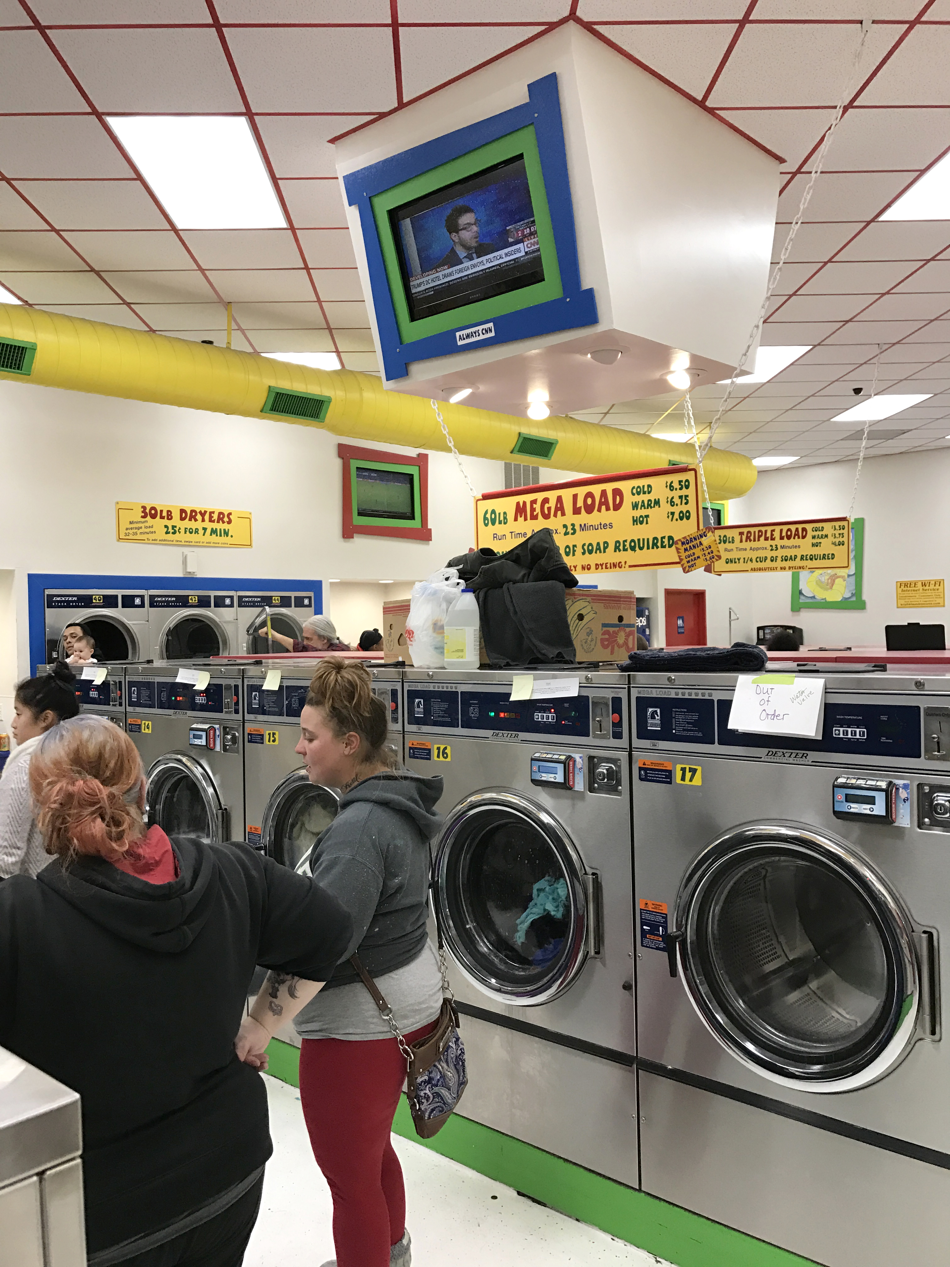 front-load-washing-machines-labled-with-peoples-names-at-the-laundry