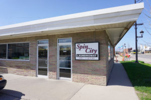 View of Spin City sign on Laundromania Coralville 24 hour Laundromat