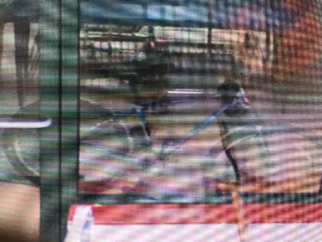 Blue bike that the man Wanted for Fraud in Iowa City at Laundromania at Sycamore Mall peddled up in