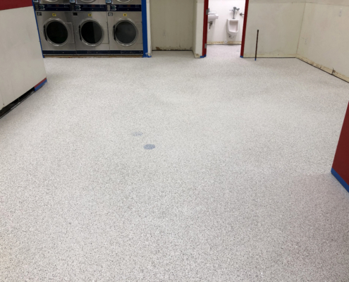 New flooring is installed at the Davenport Laundromania laundromat location