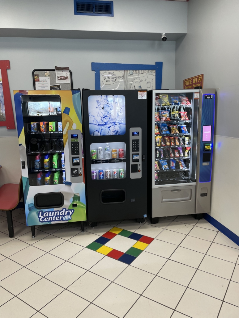 Laundry Center, Soda, and Snack Vending Machines at Sycamore Mall (Iowa City Marketplace) Laundromania in Iowa City, IA (vertical)